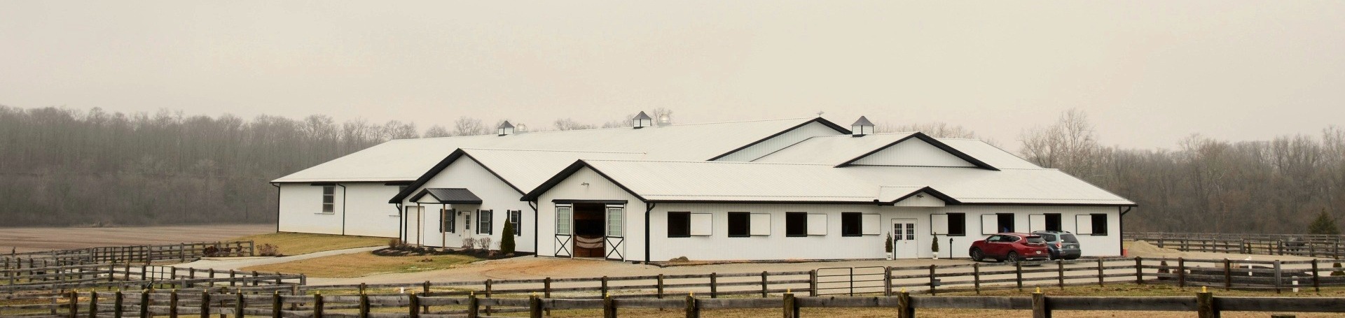 Private equestrian stable and paddocks on a quiet country morning